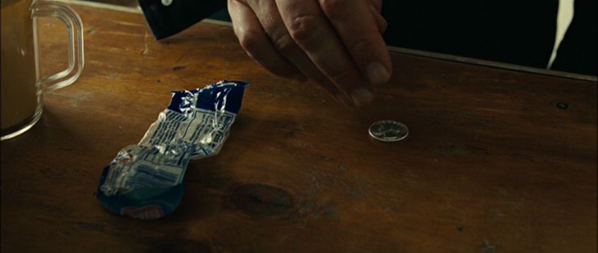 chigurh's gas station coin toss